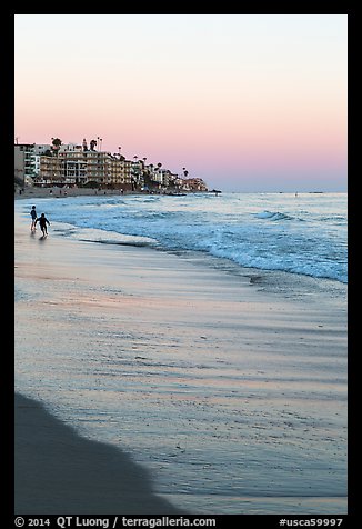 Beach at sunset with children playing. Laguna Beach, Orange County, California, USA (color)