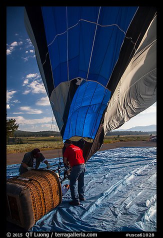 Crew pulling down hot air ballon, Tahoe National Forest. California, USA (color)