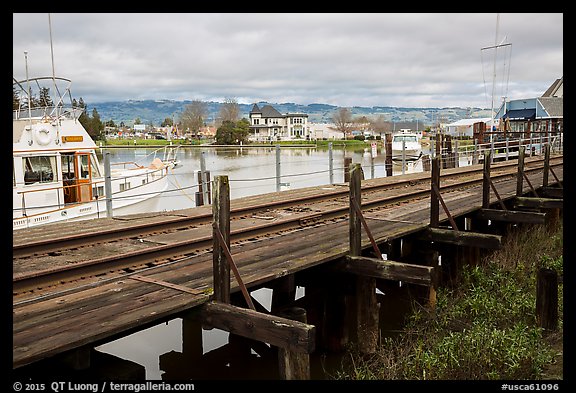 Railroad tresle and Petaluma River and Yacht Club. Petaluma, California, USA (color)