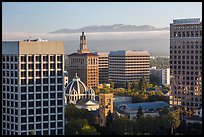 Downtown San Jose with early morning fog over hills. San Jose, California, USA ( color)