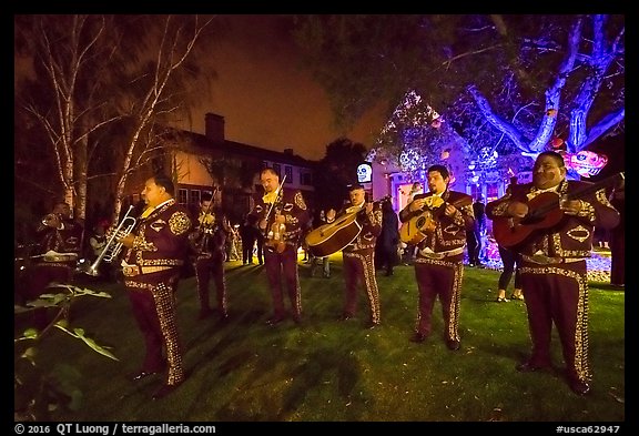Mariachi musicians in front of decorated house. Petaluma, California, USA (color)
