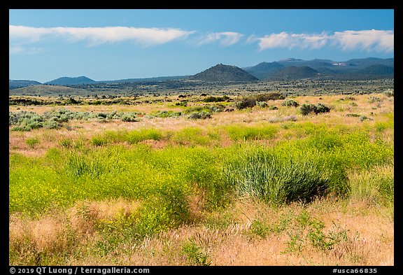 Grasslands and volcanic buttes. Lava Beds National Monument, California, USA (color)