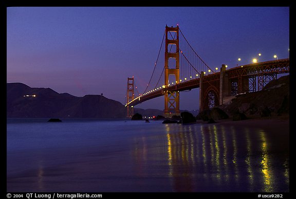Golden Gate bridge and surf with light reflections, seen from E Baker Beach, dusk. San Francisco, California, USA (color)