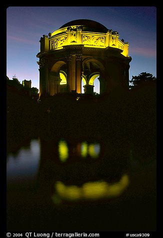 Rotunda of the Palace of Fine arts reflected in lagoon at  night. San Francisco, California, USA (color)