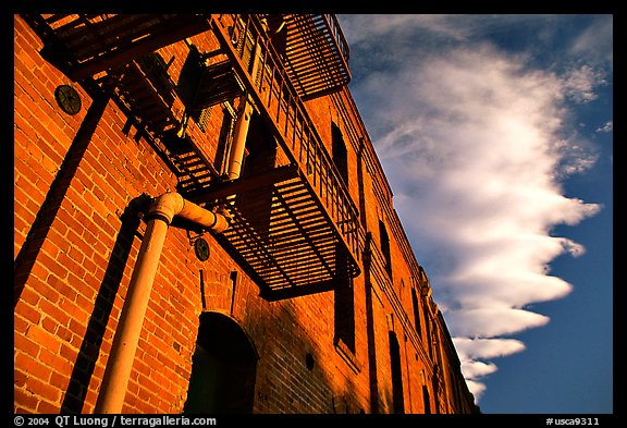 Old brick building and serrated cloud, sunset, Fisherman's Wharf. San Francisco, California, USA (color)