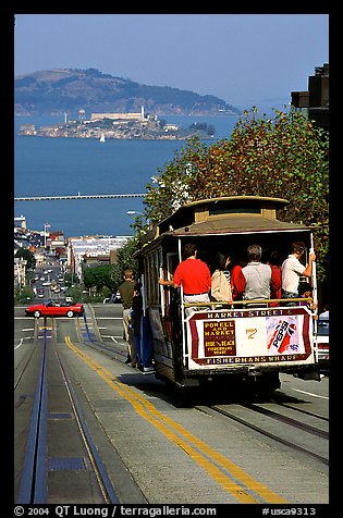 Cable car on Hyde Street, with Alcatraz Island in the background. San Francisco, California, USA