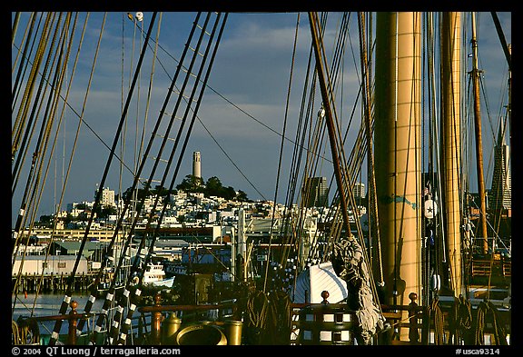 Telegraph Hill and Coit Tower seen through the masts of the Balclutha. San Francisco, California, USA (color)
