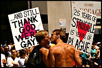 Gay couple with signs during the Gay Parade. San Francisco, California, USA