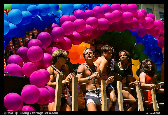 Men with rainbowed ballons on a float during the Gay Parade. San Francisco, California, USA (color)