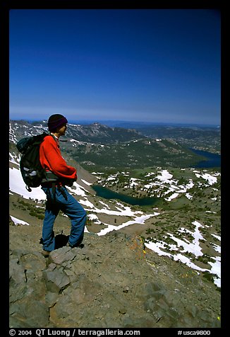 Hiker standing on top of Round Top Mountain. Mokelumne Wilderness, Eldorado National Forest, California, USA (color)