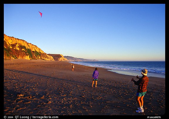 Flying a kite at Santa Maria Beach, late afternoon. Point Reyes National Seashore, California, USA