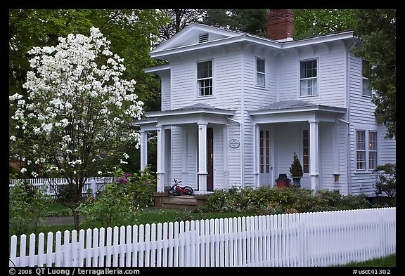 White picket fence and house, Essex. Connecticut, USA (color)