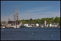 Ship, houses, and church across the Mystic River. Mystic, Connecticut, USA