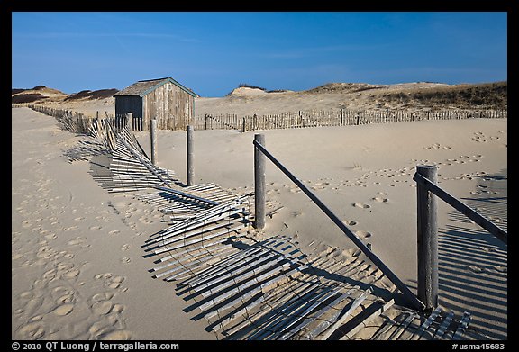 Fallen sand fence and footprints, Cape Cod National Seashore. Cape Cod, Massachussets, USA