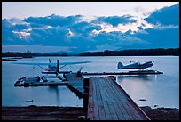 Seaplanes and dock at dusk, Ambajejus Lake. Maine, USA
