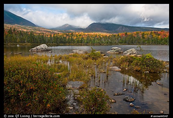Mountains with fall colors rising above pond. Baxter State Park, Maine, USA (color)