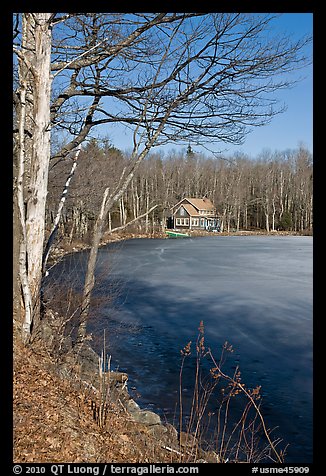 House by frozen lake. Maine, USA