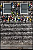 Facade decorated with buoys. Maine, USA (color)