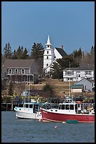 Lobster boats and village church. Corea, Maine, USA