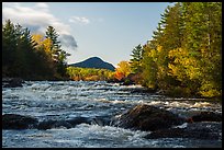 Haskell Rock Pitch cascades and Bald Mountain framed by trees in autumn foliage. Katahdin Woods and Waters National Monument, Maine, USA ( color)