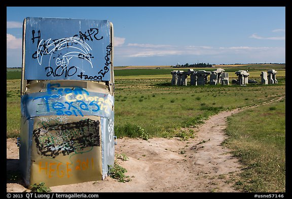 Car sculpture and distant car circle, Carhenge. Alliance, Nebraska, USA (color)