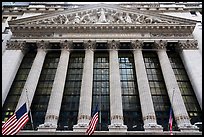 Looking up New York Stock Exchange with flags at half-mast. NYC, New York, USA ( color)