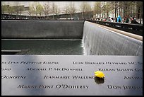Names incribed on bronze parapets, waterfalls, National September 11 Memorial. NYC, New York, USA ( color)