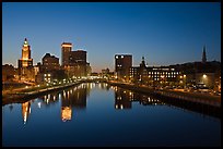 Wide view of downtown buildings reflected in Seekonk river at dusk. Providence, Rhode Island, USA
