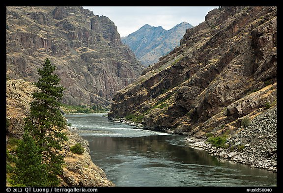 High cliffs above free-flowing part of Snake River. Hells Canyon National Recreation Area, Idaho and Oregon, USA