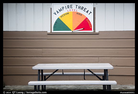 Bench and vampire threat sign near Forks. Olympic Peninsula, Washington (color)