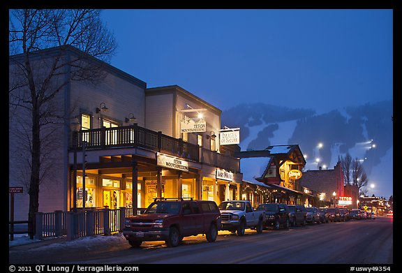 Storehouses and night-lit Snow King ski area. Jackson, Wyoming, USA (color)