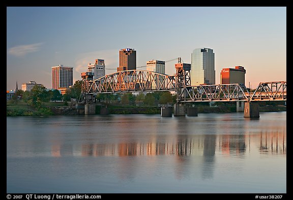 Skyline and bridge with reflections in river at sunrise. Little Rock, Arkansas, USA