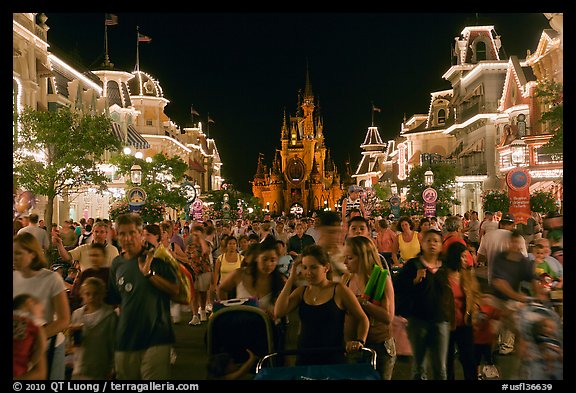 Main Street at night with crowds and castle. Orlando, Florida, USA