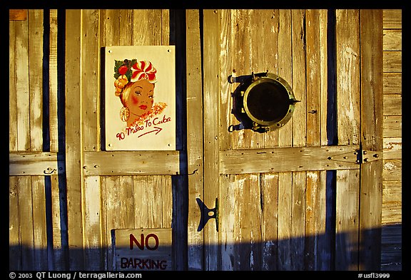 Wooden door with cuba poster. Key West, Florida, USA