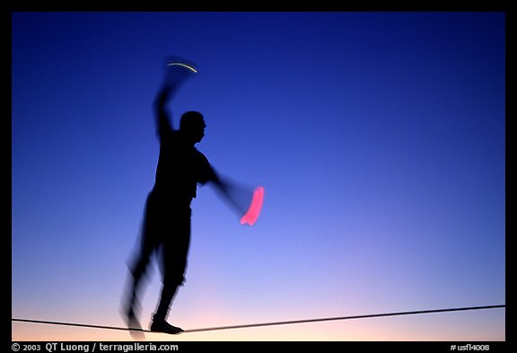 Equilibrist on Mallory Square, sunset. Key West, Florida, USA
