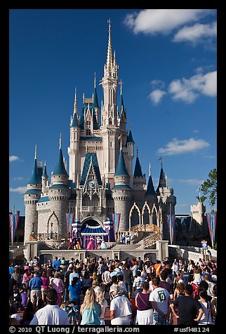 Tourists attend stage musical in front of Cindarella castle. Orlando, Florida, USA