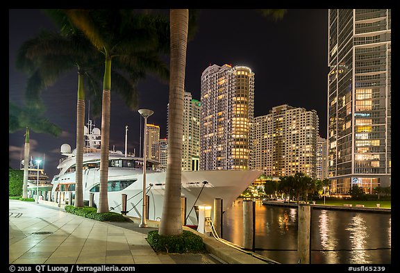 Large yacht, Miami River, and Brickell Key at night, Miami. Florida, USA (color)