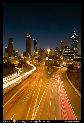 Highway and Atlanta skyline at night. Atlanta, Georgia, USA
