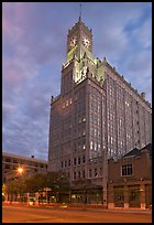 Art Deco building with clock tower at dusk. Jackson, Mississippi, USA
