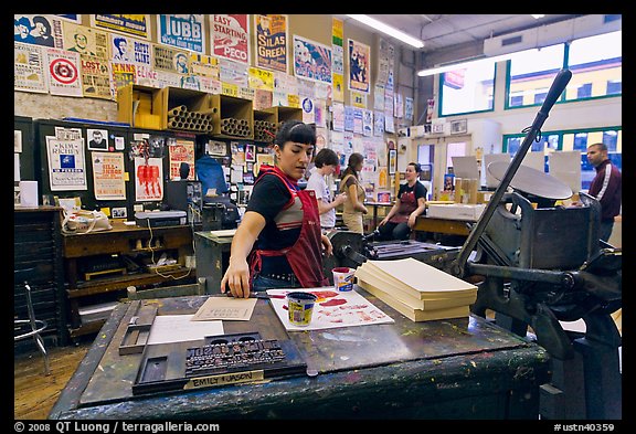Woman reaching for colored inks, Hatch Show print. Nashville, Tennessee, USA (color)