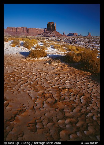 Clay pattern on floor and buttes in winter. Monument Valley Tribal Park, Navajo Nation, Arizona and Utah, USA (color)