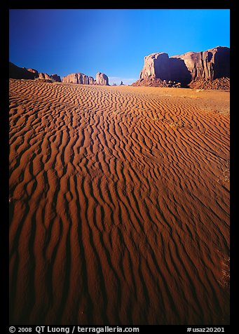 Ripples on sand dunes and mesas, late afternoon. Monument Valley Tribal Park, Navajo Nation, Arizona and Utah, USA (color)