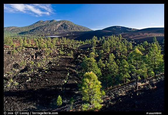 Volcanic hills covered with black lava and cinder. Sunset Crater Volcano National Monument, Arizona, USA (color)
