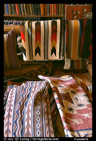 Stacks of varicolored blankets and rugs weaved by Navajo Indians. Hubbell Trading Post National Historical Site, Arizona, USA