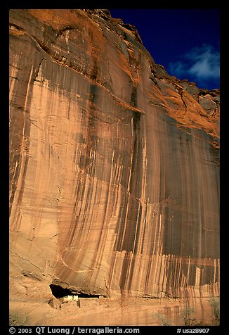White House Ancestral Pueblan ruins and wall with desert varnish and corner of sky. Canyon de Chelly  National Monument, Arizona, USA (color)