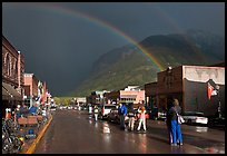 Double rainbow and dark sky over main street. Telluride, Colorado, USA (color)