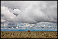 Lonely house on plain under clouds. Colorado, USA