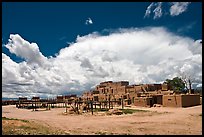 Afternoon cloud hovering over multi-family houses built by Pueblo Indians. Taos, New Mexico, USA ( color)
