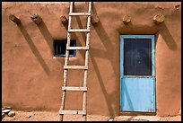Ladder on adobe facade. Taos, New Mexico, USA ( color)