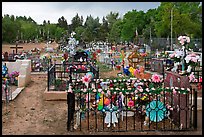 Graves with colorfull flowers. Taos, New Mexico, USA